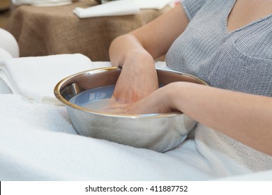 Soaking Hands In Warm Water With Softening Bath Before The Hand Massage