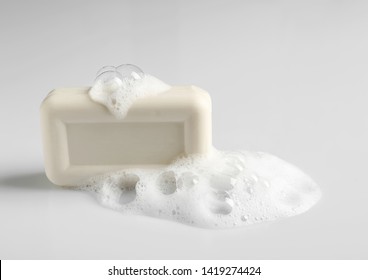 Soap Bar And Foam On White Background