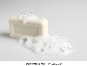 Soap Bar And Foam On White Background