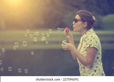 Soap bubble blower woman