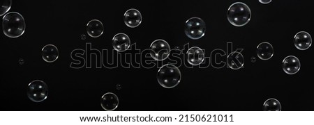 Soap bubble drop or Shampoo bubbles floating like flying in the air black background which represent refreshing moments and gentle soft. Bubbles drops for soap  shampoo or detergent product industry.