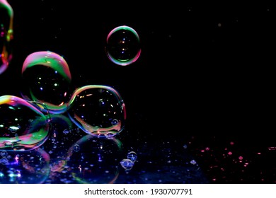 A soap bubble is an extremely thin film of soapy water enclosing air that forms a hollow sphere with an iridescent surface