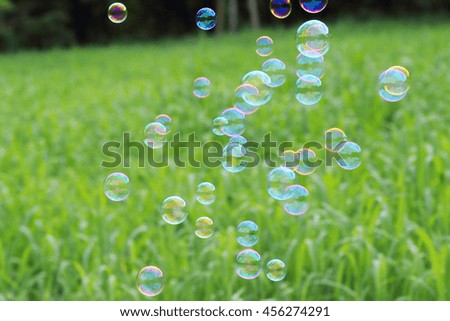 Similar – Image, Stock Photo Nu blow times fast ! (Boy portrait with soap bubbles, detail)