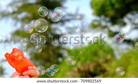 Image, Stock Photo Nu blow times fast ! (Boy portrait with soap bubbles, detail)