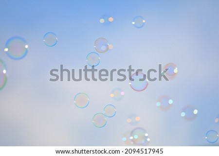 A lot of soap bubbles in the blue sky