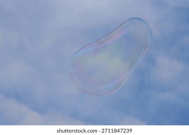 Soap bubbles float on the air in the sky.