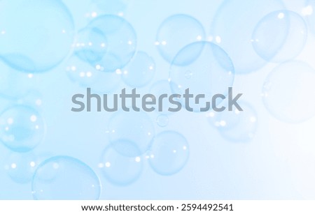 Soap Bubbles Floating in The Air.  Freshness Soap Suds Bubbles Water. Celebration Festive Backdrop. Abstract Blue Circles Textured Background.	
