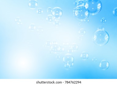 Soap bubbles  floating in the air on blue background