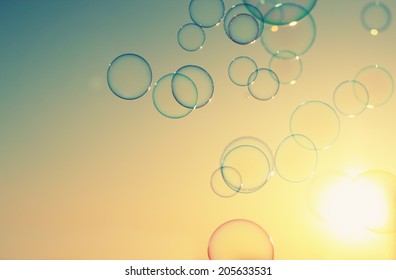 Soap bubbles floating in the air as the Summer sunsets - Powered by Shutterstock