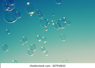 Soap bubbles floating in the air as the Summer sunsets - Powered by Shutterstock