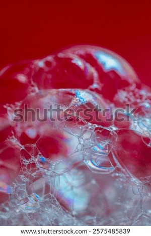Soap bubbles in macro shoot on red background