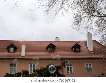 Soap bubbles on a cloudy sky