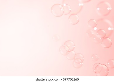 Soap bubbles on pink background