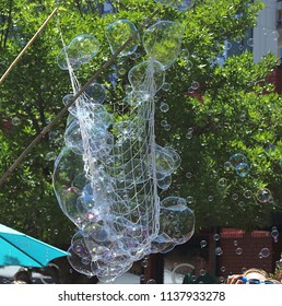 Soap Bubbles With Street Background On Cherry Creek Art Festival In Denver, Colorado