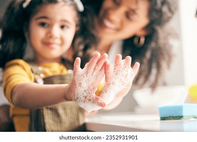 Soap, cleaning hands and family with child in bathroom for learning healthy hygiene routine at home. Closeup, mom and girl kid washing palm with foam for safety of bacteria, dirt or germs on skincare - Powered by Shutterstock