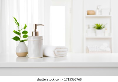 Soap dispenser and spa towel on pastel bathroom window interior - Shutterstock ID 1715368768