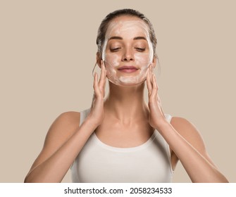 Soap face woman clean skin beauty. Color background. Brown