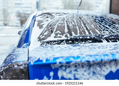 Soap Foam Drips Down The Glass. Self-service Car Wash