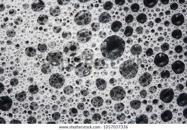 Soap Foam On Black Background Stock Photo (Edit Now) 1057037336