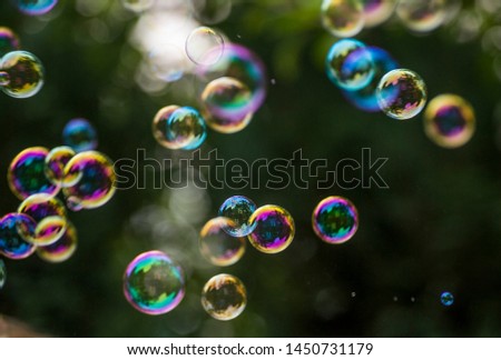 Similar – Image, Stock Photo Nu blow times fast ! (Boy portrait with soap bubbles, detail)