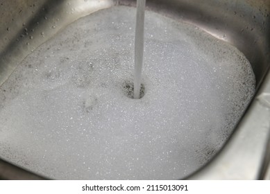 Soap Suds In A Clogged Kitchen Sink