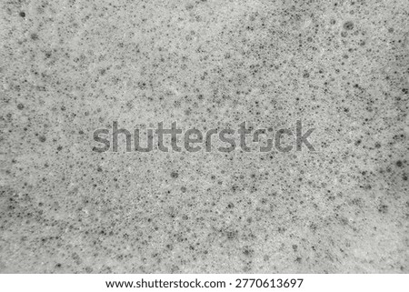 Soap suds foam and bubbles create an organic, textured background element.