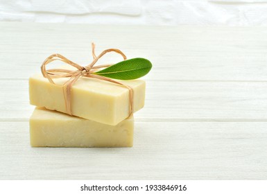 Soaps isolated on white wooden table