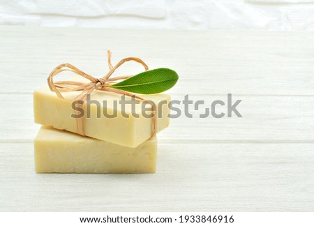 Soaps isolated on white wooden table