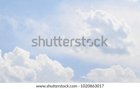 Soaring clouds in the blue sky