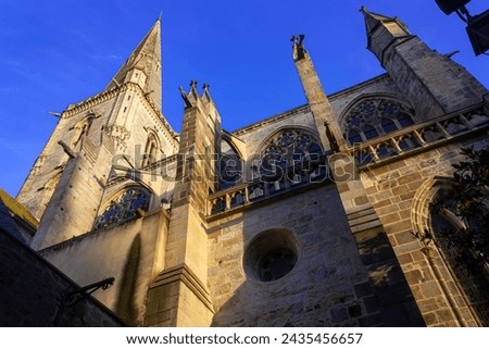 The soaring spire and buttresses of a gothic church