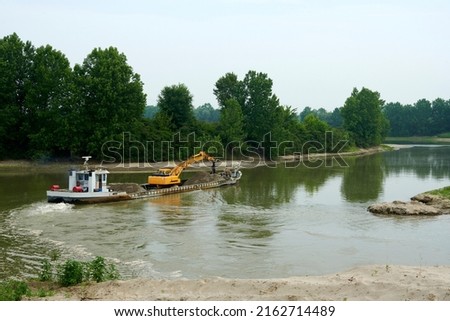 Soarza (Pc), Italy,  a barge to dig sund on the river Po