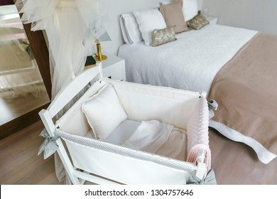 Sober And Elegant Bedroom With Cot With Canopy And Double Bed. Selective Focus On Cot In Foreground