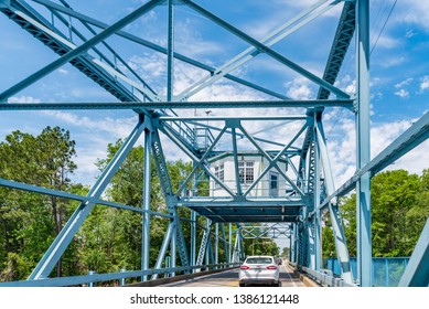 Socastee, South Carolina / USA - April 29, 2019: The local swing bridge in Socastee, a section of Myrtle Beach, that allows cars to cross the intercoastal waterway. As well as allowing boats to pass.