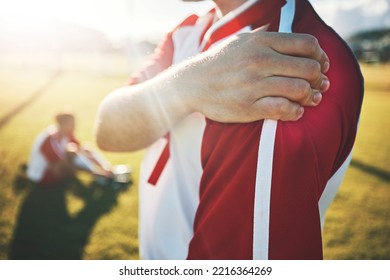 Soccer, Athlete And Shoulder Pain With An Injury From A Sports Match Or Training On A Field. Fitness, Football And Man With A Medical Emergency Of Muscle, Joint Or Bone Sprain During An Exercise.