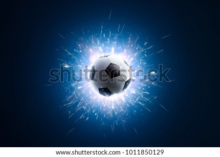 Soccer ball. Soccer background with fire sparks in action on the black. Soccer