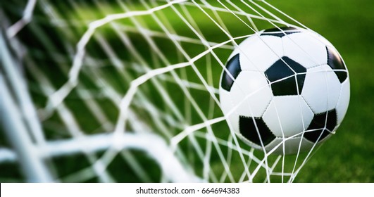 Soccer Ball In Goal On Green Grass