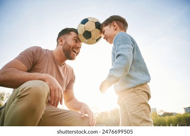 Soccer ball, holding it by heads, fun. Happy father with son are on the field at summertime. - Powered by Shutterstock