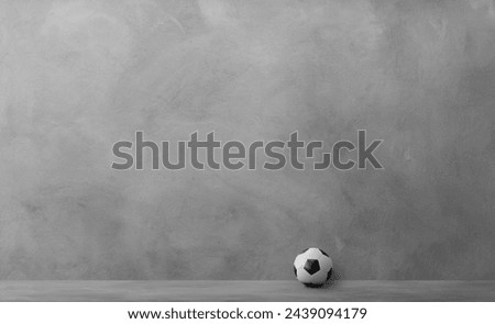 Soccer ball with light and shadow on the cement floor
