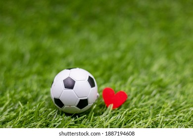 Soccer Ball With Love On Green Grass