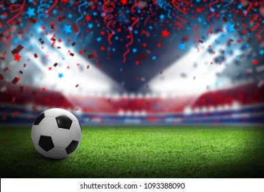 Soccer ball on football field in stadium with spotlight