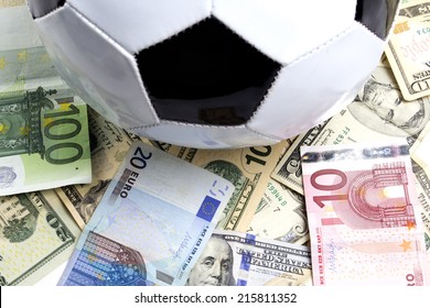 soccer ball over a lot of money - Powered by Shutterstock