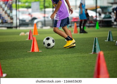 Soccer Ball Tactics A Boy On Grass Field With Cone Ball Control Skill For Training Children In Soccer Academy