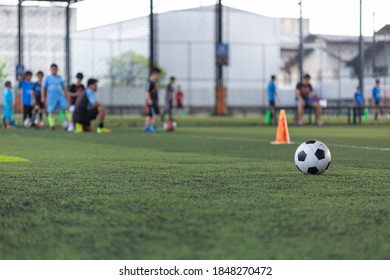 Soccer ball tactics cone on grass field with for training background Training children in Soccer