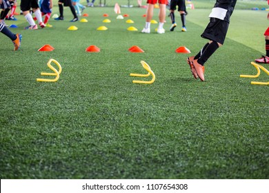 Soccer ball tactics on grass field with cone for training thailand in  background Training children in Soccer academy