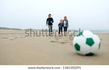 Similar – Girl and senior woman playing on the beach