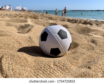 Soccer ball toy on the beach - Powered by Shutterstock