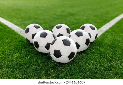 Soccer balls sitting on the corner of the soccer field. Good soccer concept photo or soccer tournament photo	
