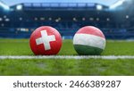 Soccer Balls with Switzerland and Hungary Flags on Grass Field – European Football Championship 2024 in Germany
