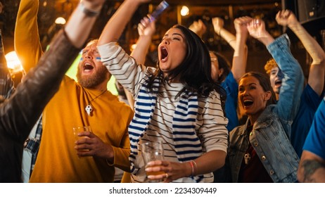 Soccer Club Members Cheering for Their Team, Playing in an International Cup Final. Supportive Fans Standing in a Bar, Cheering, Raising Hands and Shouting. Friends Celebrate Victory After the Goal. - Powered by Shutterstock