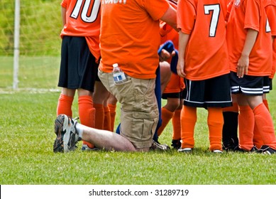 Soccer Coach With Team